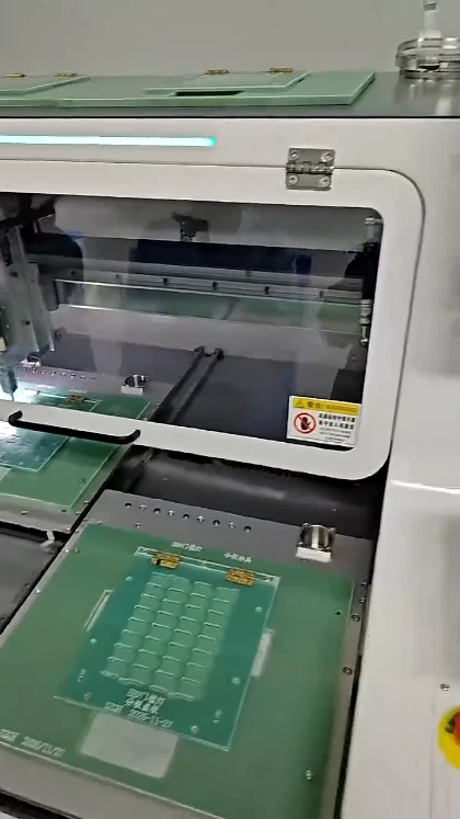 Slotted green panel and fixture at the loading side of the JELIO depaneling machine